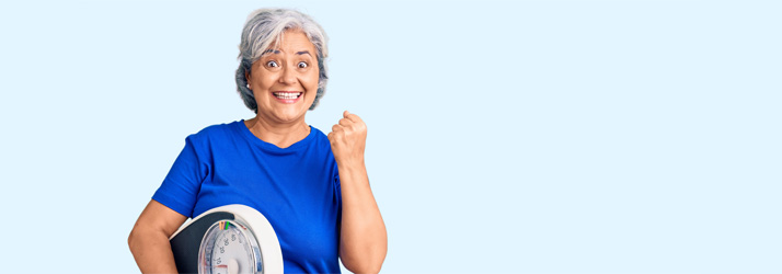 Weight Loss Excited Woman with Scale